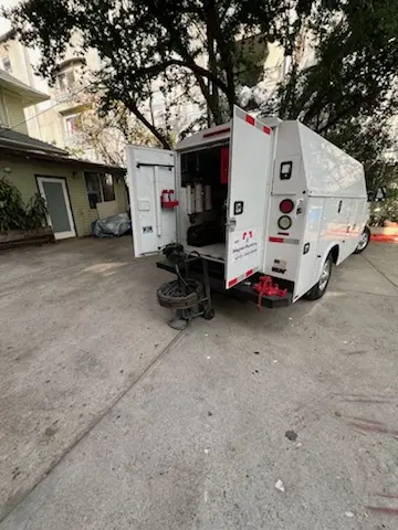 Magnet Plumbing service vehicle on-site for Grease Trap Cleaning in Carbonado